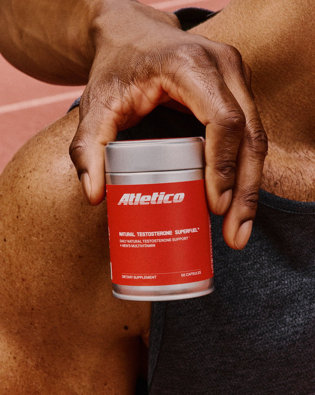 The SuperFuel tin with two capsules in front of it on an off-white sweep
